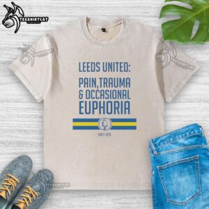 Official Leeds United 'Pain, Trauma, and Occasional Euphoria Since 1919' washed t-shirt displayed on a neutral background.