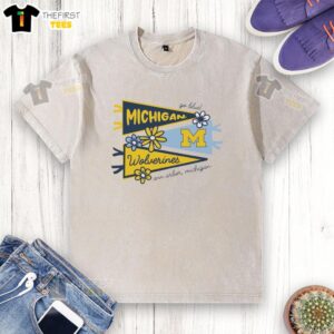 Alt Text: Awesome Michigan Wolverines flags displayed on a washed t-shirt in Ann Arbor, Michigan, showcasing team spirit.