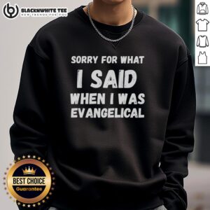 Cozy 'Sorry For What I Said When I Was Evangelical' sweatshirt displayed on a wooden background, ideal for casual wear.
