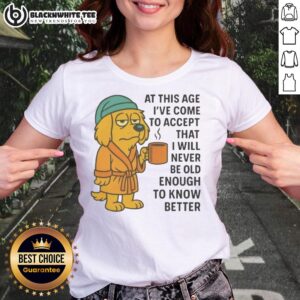 Top sleepy dog in a robe with a coffee mug, showcasing 'Never Old Enough to Know Better' ladies tee design.