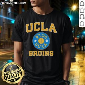 Alt Text: Premium UCLA Bruins Basketball 2026 logo retro t-shirt featuring a vintage design and team colors on a stylish fit.