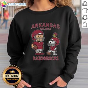 Alt Text: Official Charlie Brown and Snoopy Arkansas Razorbacks NCAA Football sweatshirt, celebrating Est. 1894 style and fandom.