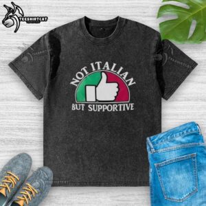 Good Not Italian But Supportive washed t-shirt displayed on a hanger against a simple background, showcasing its casual style.