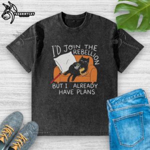 Alt Text: Lazy cat lounging on the couch, wearing a funny washed T-shirt, embodying a humorous rebellion vibe.