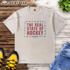 Nice Colorado The Real State of Hockey washed t-shirt displayed on a wooden background, showcasing its vintage style.