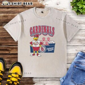 Alt Text: Top Mitchell & Ness Cream St. Louis Cardinals Step Back Up Washed T-Shirt displayed on a wooden background.