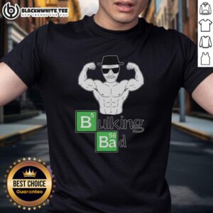 Awesome old man with muscular arms flexing biceps in a 'Bulking Bad' t-shirt, showcasing strength and confidence.