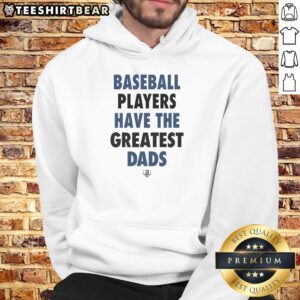 Nice baseball players with their greatest dads wearing a stylish hoodie, celebrating teamwork and family spirit.