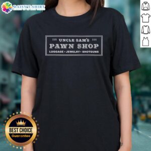 Alt Text: Official Uncle Sam's Pawn Shop display featuring luggage, jewelry, and shotguns on a ladies' tee shirt.