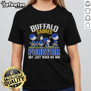 Official Peanuts characters and Buffalo Sabres logo on a ladies tee, celebrating fandom with 'Forever, Not Just When We Win' slogan.