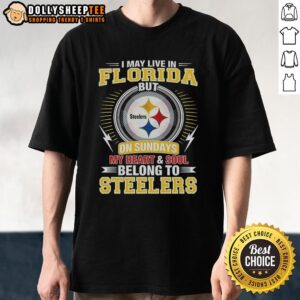 Alt Text: Official Pittsburgh Steelers NFL T-shirt: 'I May Live In Florida, But My Heart Belongs To Steelers' design.