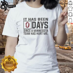 Premium ladies tee with '0 Days Since A Minnesota Team Has Hurt Me' graphic, perfect for sports fans and humor lovers.
