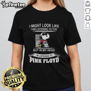 Alt Text: Official Snoopy I Might Look Like I Am Listening To You But In My Head Ladies Tee featuring iconic Snoopy design.