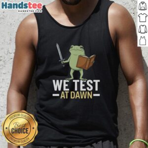 Model wearing a Nice We Test At Dawn tank top, showcasing its stylish design against a vibrant sunrise backdrop.