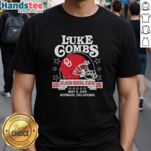 Alt Text: Hot Oklahoma Sooners helmet featured on Luke Combs May 09, 2026 tour t-shirt in Norman, OK, showcasing team pride.