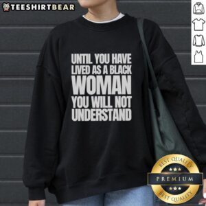 Black woman wearing 'Nice Until You Have Lived As A Black Woman' sweatshirt, showcasing empowerment and resilience.