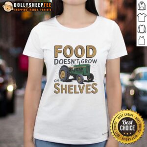 Vintage ladies tee featuring 'Food Doesn't Grow on Shelves' slogan with a classic tractor graphic for farm enthusiasts.