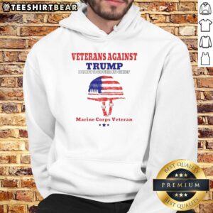 Top Veterans Against Draft Dodger In Chief hoodie worn by Marine Corps veteran, showcasing patriotic support.