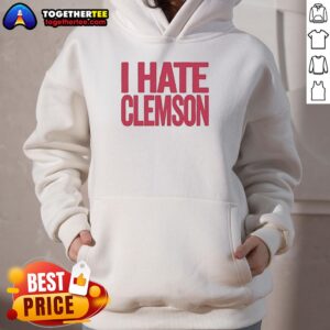 Good Greg Clark I Hate Clemson hoodie worn by a fan at a football game, showcasing team spirit and rivalry.