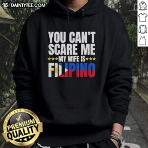 Awesome 'You Can't Scare Me, My Wife Is Filipino' hoodie in a casual setting, perfect for proud husbands and Filipino culture.
