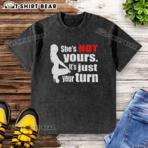 Alt Text: Original 'The Woman Squatting' washed t-shirt featuring the phrase 'She's Not Yours, It's Just Your Turn'.