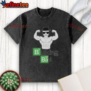 Muscular old man posing with biceps in a bulking bad washed t-shirt, showcasing strength and fitness.
