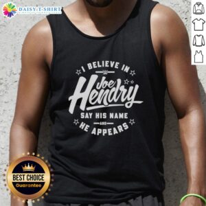 Joe Hendry WWE fan wearing a 'Good I Believe in Joe Hendry' tank top, showcasing his support for the wrestling star.