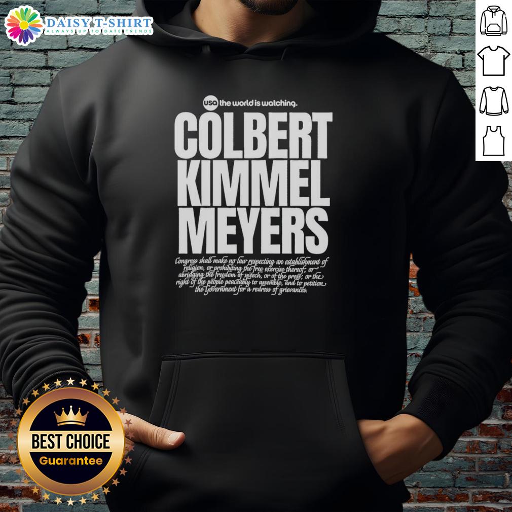 Top Usa The World Is Watching Colbert Kimmel Meyers Hoodie Top USA hoodie featuring 'The World Is Watching' design, inspired by Colbert, Kimmel, and Meyers.