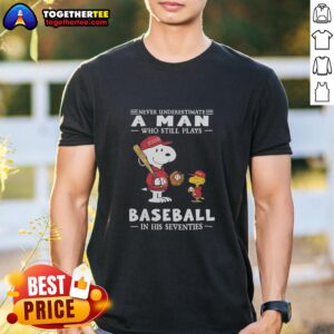 Alt Text: Peanuts X St Louis Cardinals t-shirt featuring 'Never Underestimate A Man Who Plays Baseball In His Seventies' design.