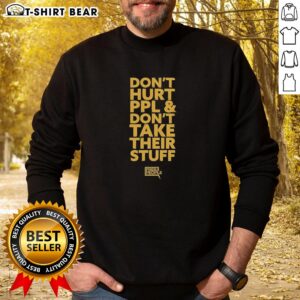 Original 'Don't Hurt People and Don't Take Their Stuff' sweatshirt in a casual setting, promoting kindness and empathy.