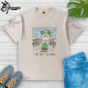 Charming pig pen scene featuring a tiny rat, with 'I Love' characters on a washed t-shirt, showcasing a cozy setup.