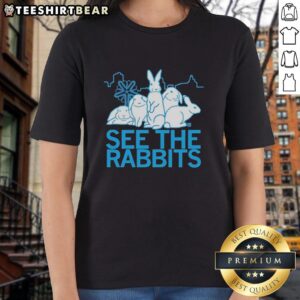 Premium See The Rabbits Blue Vintage Ladies Tee with a stylish graphic design, perfect for casual outfits.