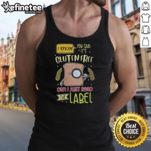 Alt Text: Woman wearing a 'Gluten-Free' tank top while examining a food label in a grocery store. Premium tank top design.