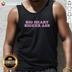 Model wearing a 'Good Big Heart Bigger Ass' tank top, showcasing a trendy and fun graphic design for casual wear.