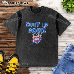 Alt Text: 2026 Good Shut Up Doris Fan Club Oklahoma City Thunder basketball logo on a washed t-shirt design.