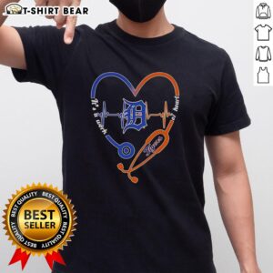Top Detroit Tigers Stethoscope Heartbeat T-Shirt - It's A Work Of Heart design for baseball fans and medical professionals.