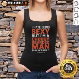 Chubby bearded man wearing a tank top in Savannah, GA, humorously embracing his sexy side with a playful expression.