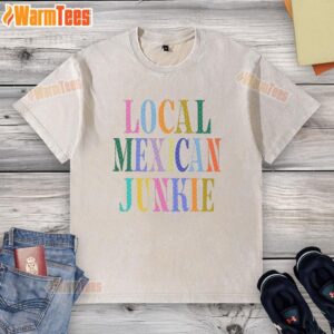 Top Local Mexican Junkie washed t-shirt displayed on a rustic wooden background, showcasing vibrant colors and unique design.