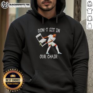 David Alaba celebrating in an 'Don't Sit In Our Chair' hoodie, showcasing style and team spirit on the field.
