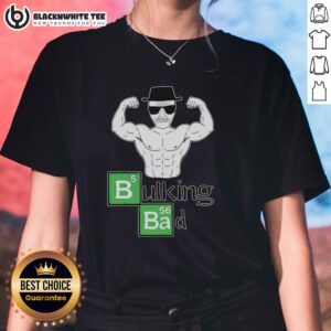 Muscular old man flexing biceps in a 'Bulking Bad' tee, showcasing strength and confidence in a playful pose.