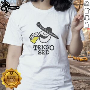 Man in Mexico enjoying a cold beer on a Friday, wearing a ladies' tee, capturing the essence of Nice Tendo vibes.
