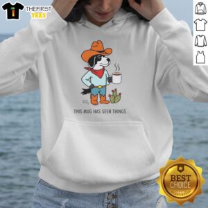 Alt Text: Cozy hoodie featuring 'This Mug Has Seen Things' design by Nice Sam Larson, perfect for cowdog lovers and coffee enthusiasts.