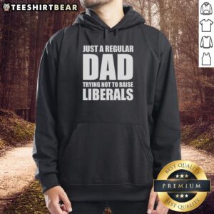 Alt Text: Premium hoodie featuring 'Just A Regular Dad Trying Not To Raise Liberals' humorous design for dads.