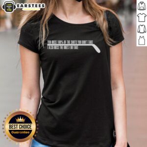 Funny ice sport player missing shots on rink, showcasing the motto '100% of shots you don't take' on ladies' tee.