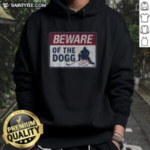Hot Nathan MacKinnon in a stylish 'Beware Of The Dogg' hoodie, showcasing his trendy fashion sense and NHL spirit.