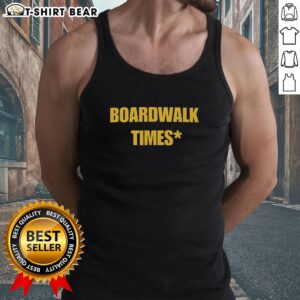 Model wearing a Good Boardwalk Times Star Tank Top, showcasing a stylish summer look on the beach boardwalk.
