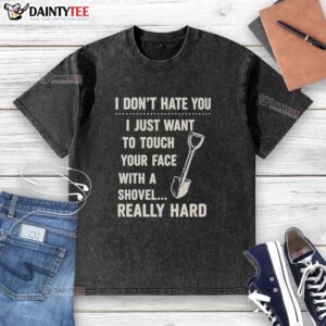 Vintage washed t-shirt featuring 'I Just Want To Touch Your Face With A Shovel' graphic for unique style and humor.