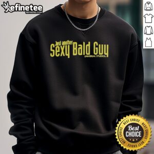 Stylish bald man wearing a Universal Studios sweatshirt, showcasing a trendy look at a theme park.