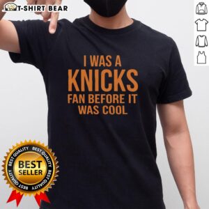 Alt Text: Orange New York Knicks t-shirt with 'I Was A Knicks Fan Before It Was Cool' text, perfect for Knicks fans.