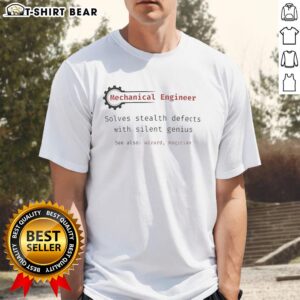 Top mechanical engineer wearing a 'Silent Genius' T-shirt while solving stealth defects in a workshop setting.